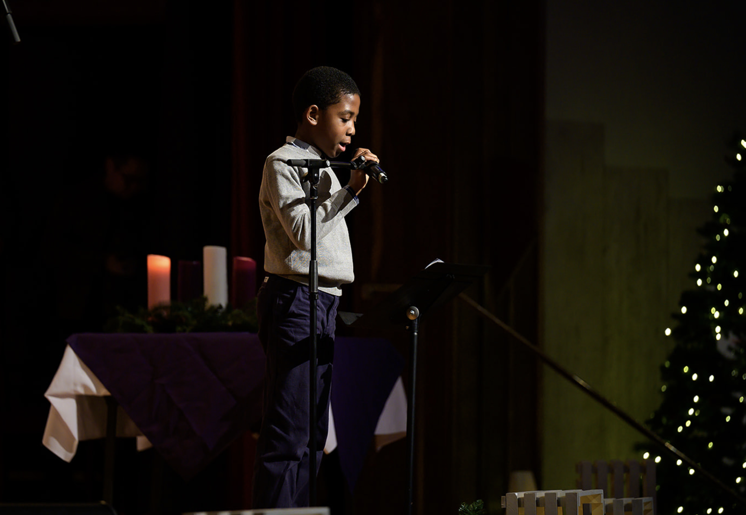 A young person participating in a Christmas service